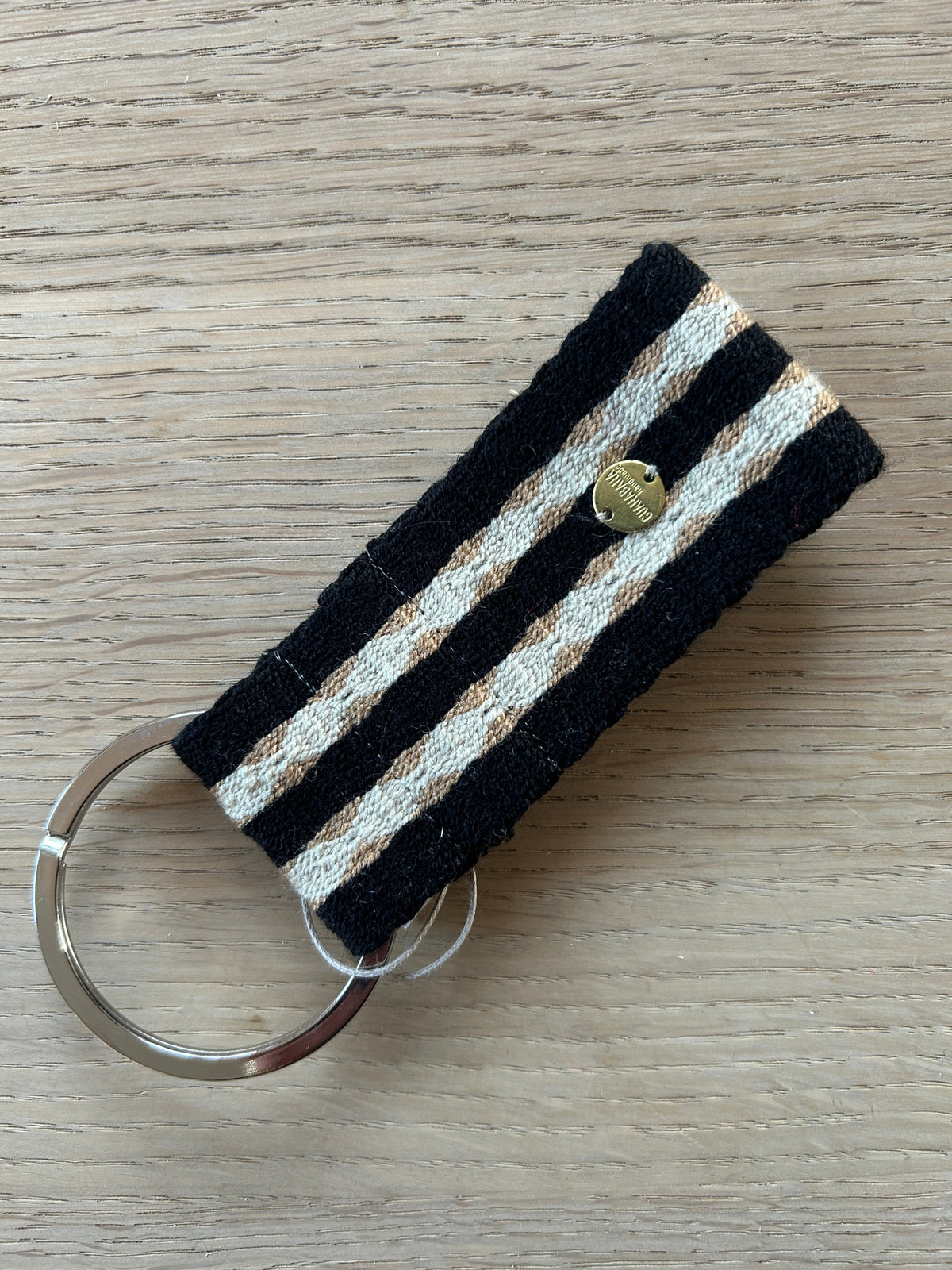 Guanabana nøglering sort/sand strib